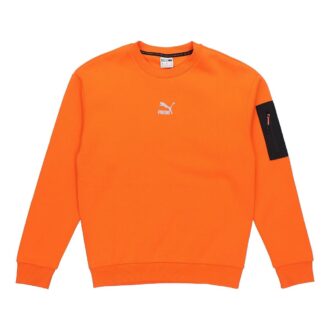 Avslappnad lös rund halsad pullover med låg orange färg