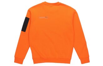 Avslappnad lös rund halsad pullover med låg orange färg
