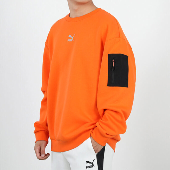 Avslappnad lös rund halsad pullover med låg orange färg