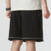 Logotypshorts ”Svarta med vita sömmar”
