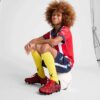 PUMA x CHRISTIAN PULISIC TACTO II fotbollsskor för barn, fast/konstgjord mark PUMA x CHRISTIAN PULISIC TACTO II fotbollsskor för barn, fast/konstgjord mark