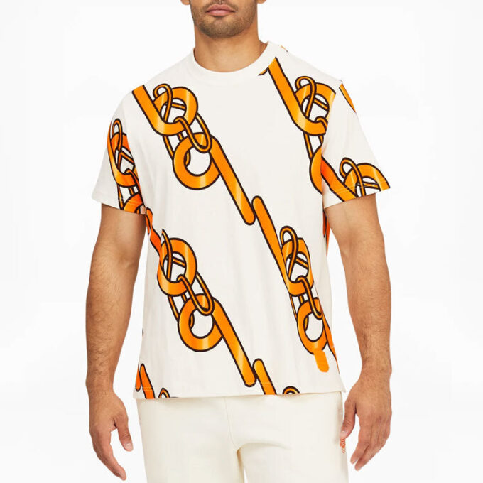 PUMA x PRONOUNCE Unisex T-shirt med grafisk design, korsad kedjetryck, Athleisure, casual, sport, kortärmad, krämig vit